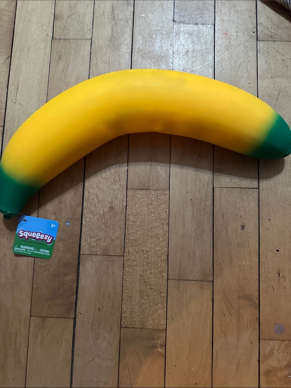 Squeeezy Yellow Banana Party Prop with Green Tips